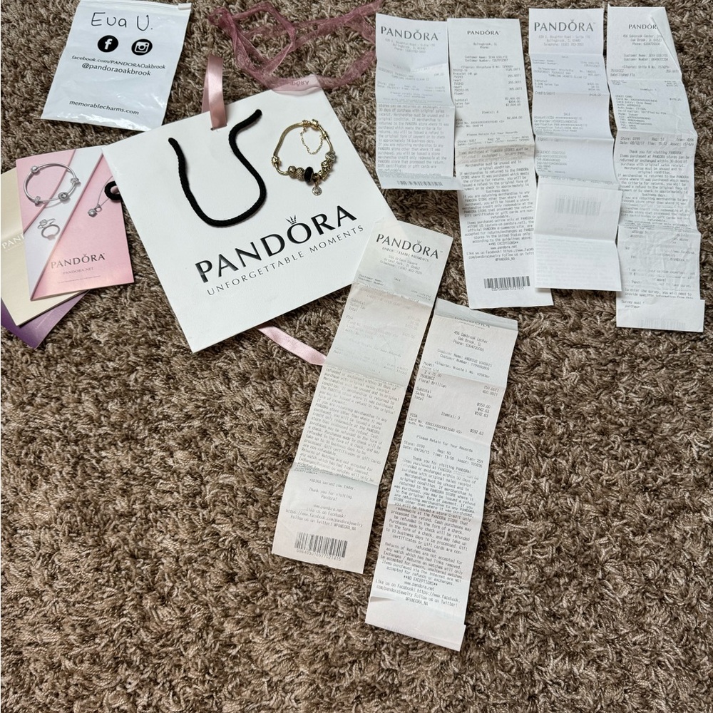 14k Gold Pandora bracelet with gold charms